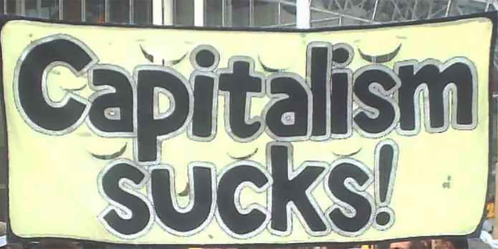 Banner that reads Capitalism sucks