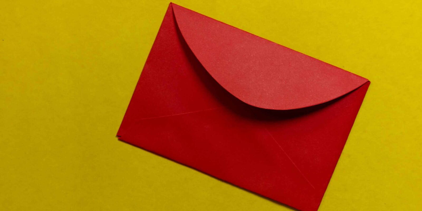 Red envelope on green surface